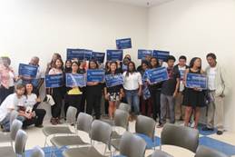 Young supporters for Uche Uwahemu attend the Hilltop Mall Debate. (Photo by Larry Zhou)